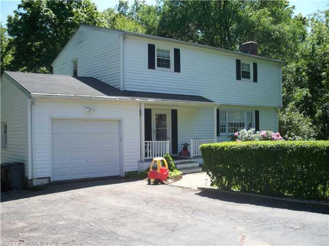 a view of a house with entertaining space and a garage