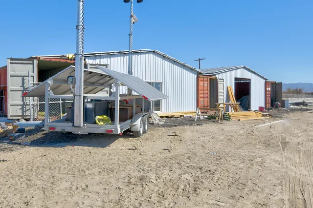an aerial view of a house with a terrace patio and balcony