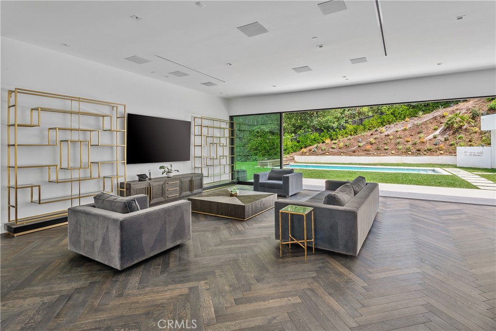 9924 Liebe Drive Beverly Hills, CA 90210 - Photo 12 of 65 a living room with furniture and a flat screen tv