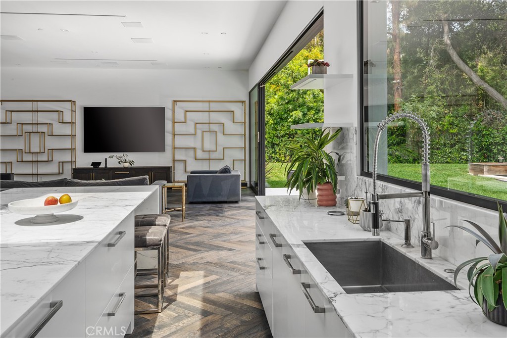 9924 Liebe Drive Beverly Hills, CA 90210 - Photo 22 of 65 a kitchen with a large window and a sink