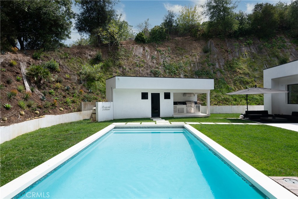 9924 Liebe Drive Beverly Hills, CA 90210 - Photo 49 of 65 a view of a house with a yard and sitting area