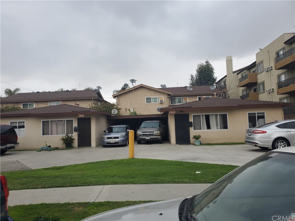 7913 Howe Street Paramount, CA 90723 - Photo 13 of 17 a view of a car park in front of house