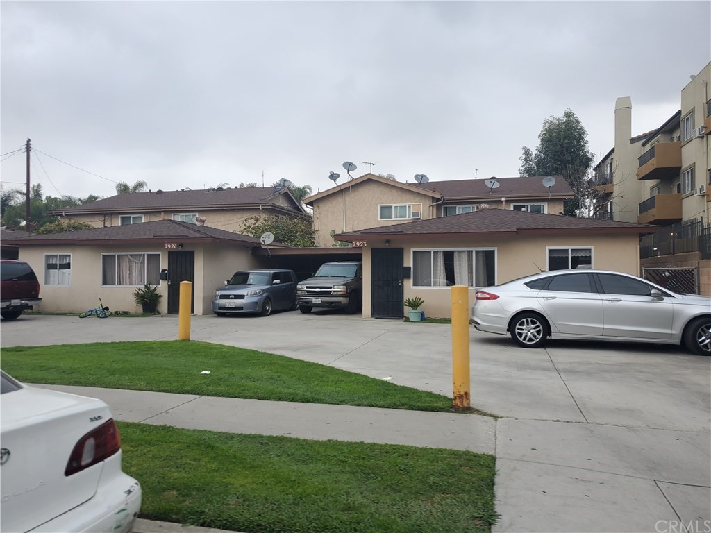 7913 Howe Street Paramount, CA 90723 - Photo 15 of 17 a view of a house with a garden and parking space