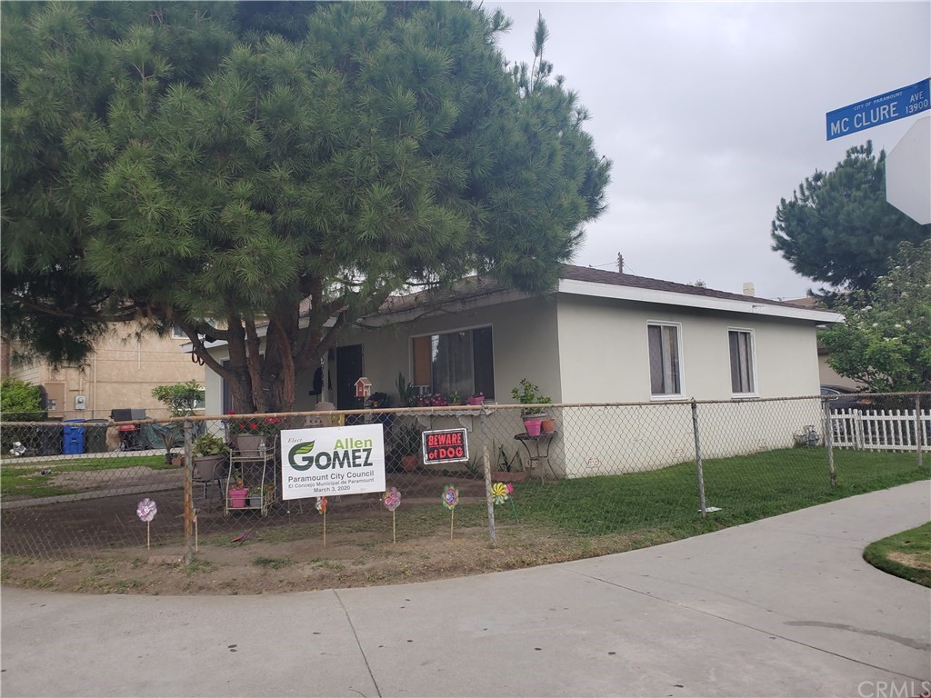 7913 Howe Street Paramount, CA 90723 - Photo 2 of 17 a front view of a house with a garage