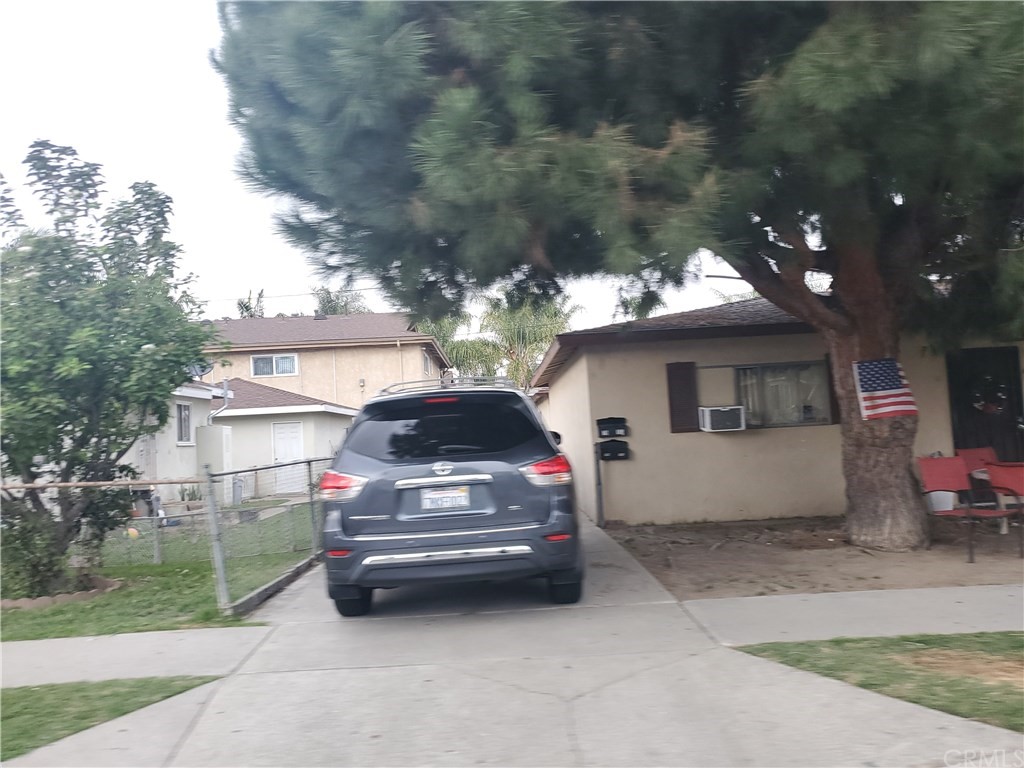 7913 Howe Street Paramount, CA 90723 - Photo 4 of 17 a car parked in front of a house