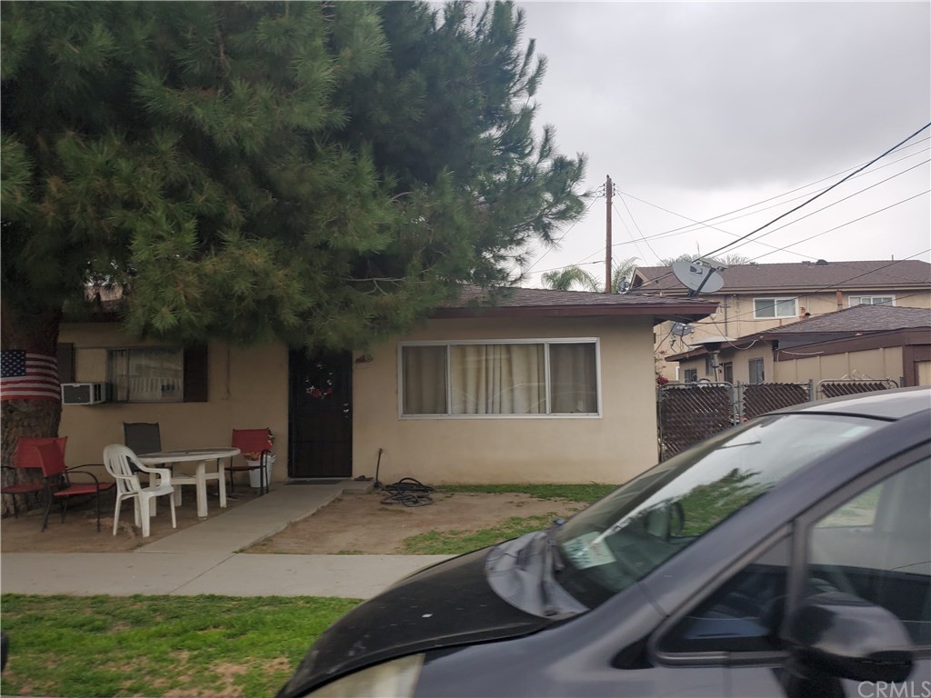 7913 Howe Street Paramount, CA 90723 - Photo 6 of 17 a view of a house with backyard and sitting area