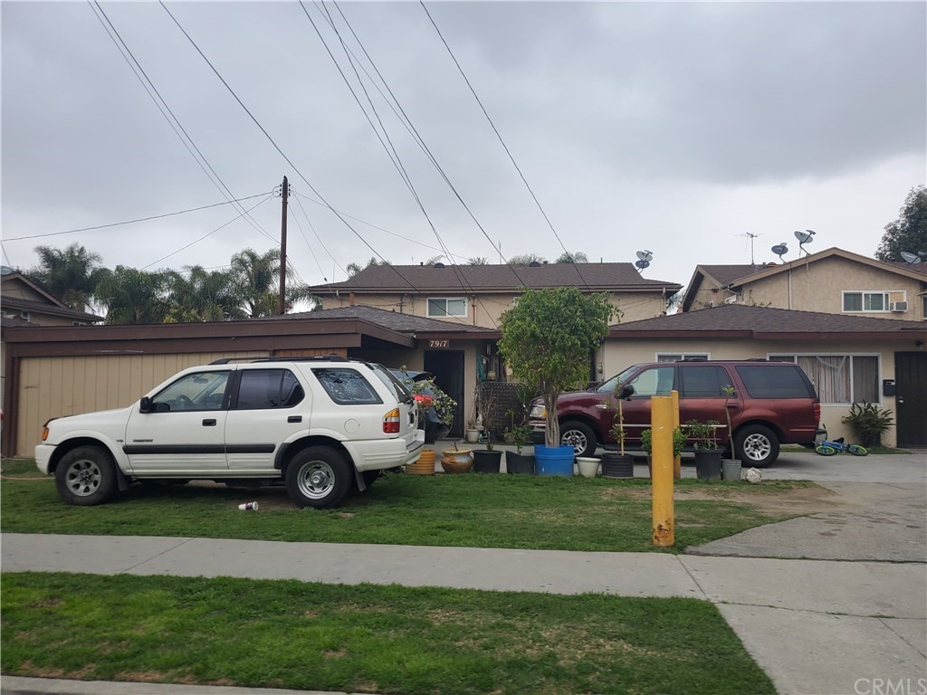 7913 Howe Street Paramount, CA 90723 - Photo 9 of 17 a car parked in front of a house