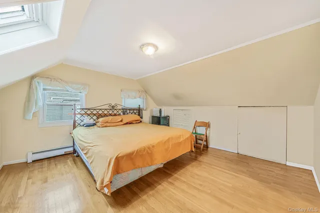 a bedroom with a bed and cabinets