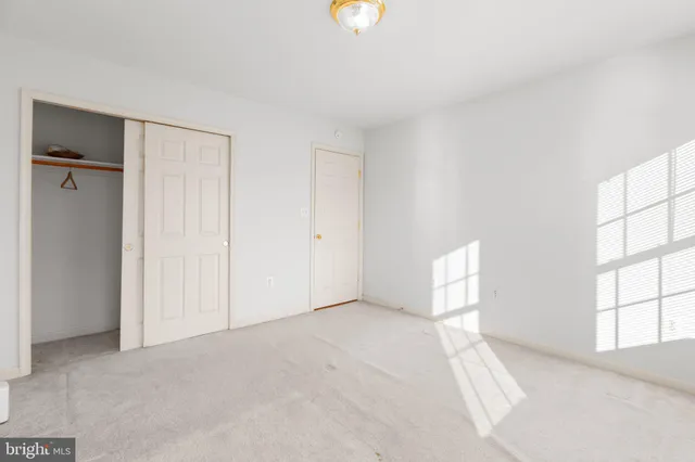 a view of a room with wooden floors
