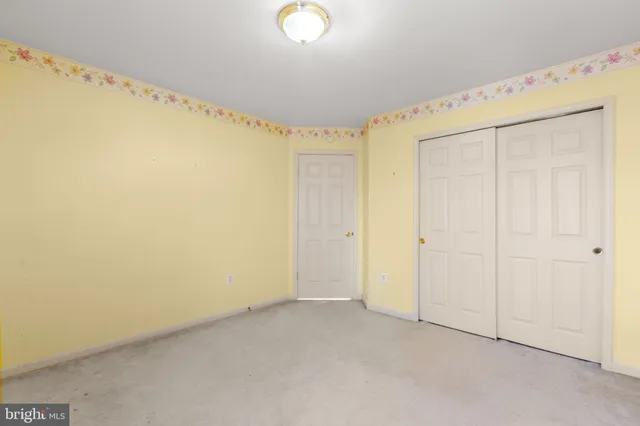 a view of a house with wooden deck