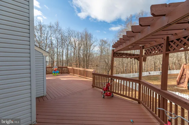 an aerial view of a house with garden space and lake view