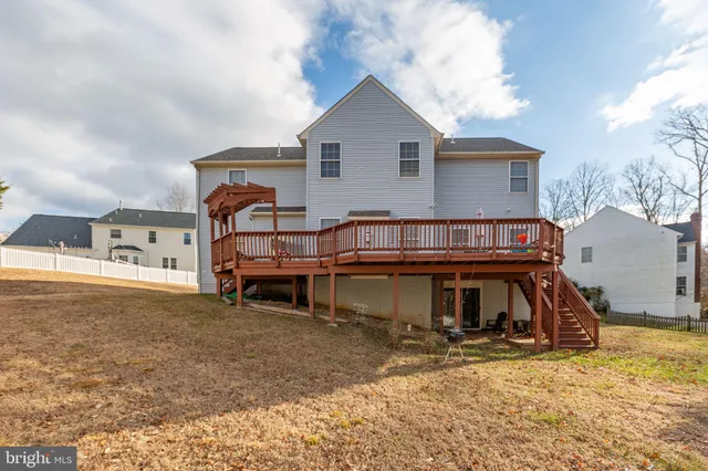 an aerial view of a house with outdoor space