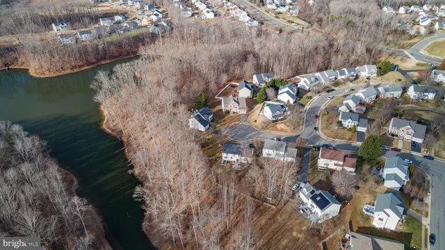an aerial view of houses with outdoor space