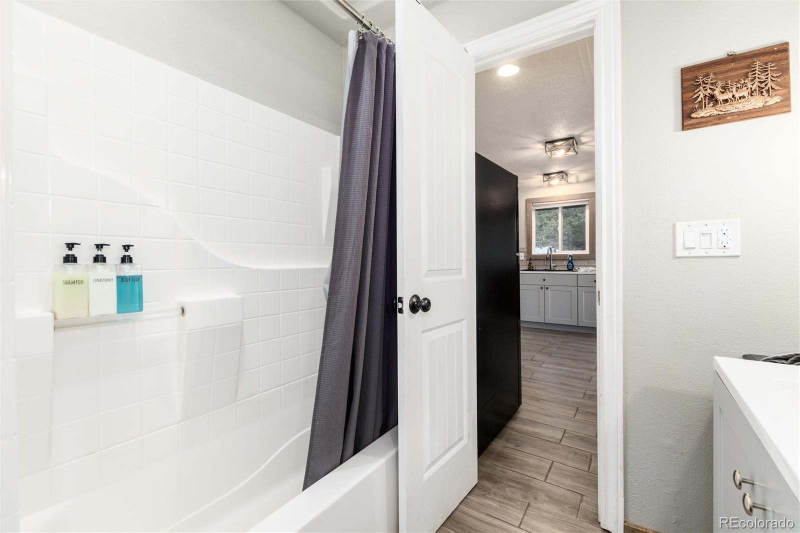 159 Lake Road Idaho Springs, CO 80452 - Photo 16 of 45 a bathroom with a bathtub