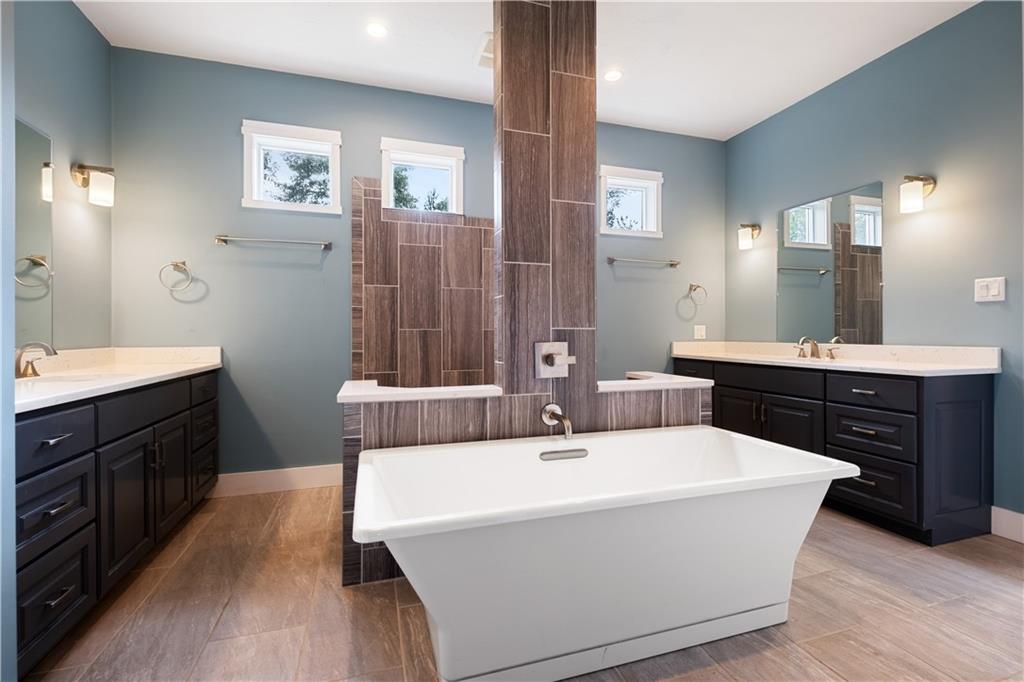 3396 5 Points Road Indiana, PA 15701 - Photo 30 of 49 a spacious bathroom with a bathtub sink double vanity and mirror