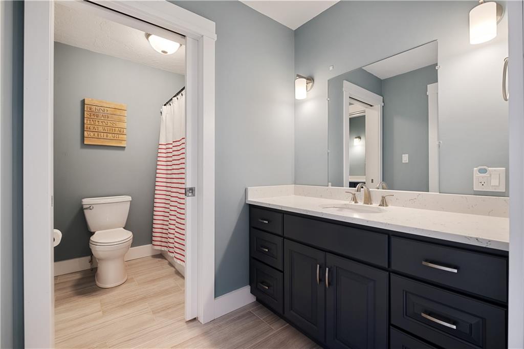 3396 5 Points Road Indiana, PA 15701 - Photo 36 of 49 a bathroom with a toilet a sink and mirror