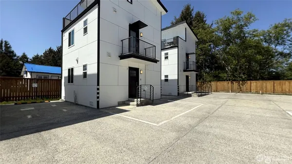a view of a house with a small yard