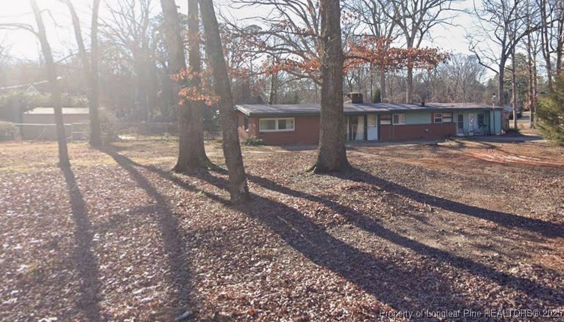 5813 Oak Forest Drive Raleigh, NC 27616 - Photo 10 of 10 a view of a yard with trees