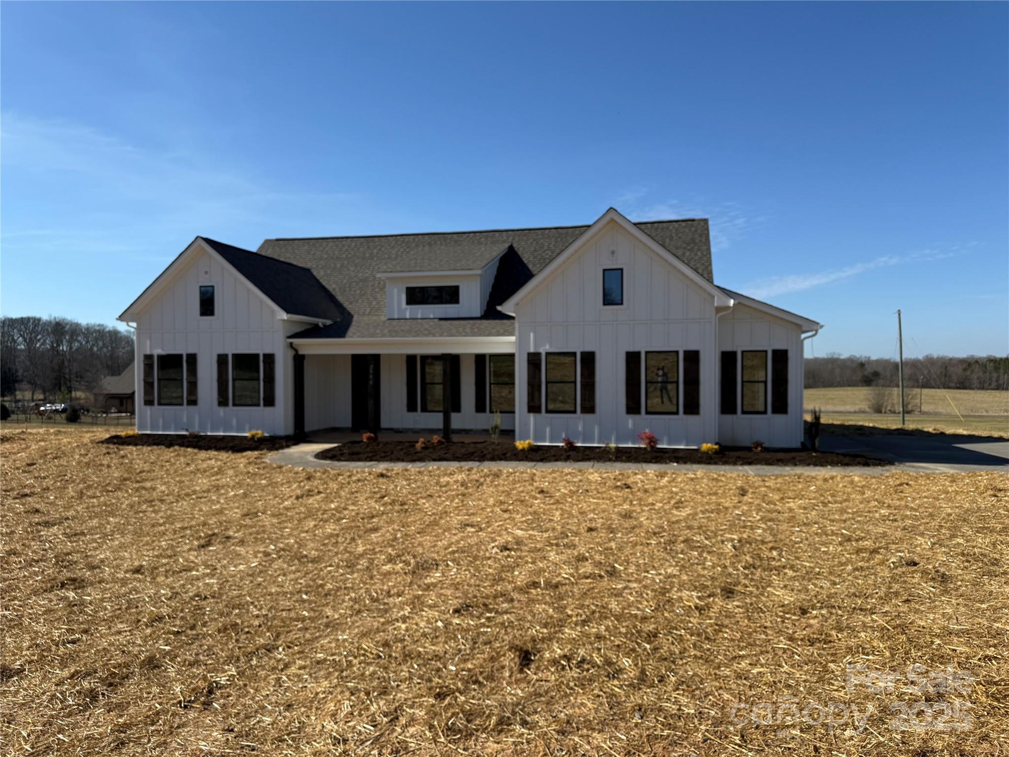 2906 Lathan Road Monroe, NC 28112 - Photo 1 of 41 a front view of a house with a yard