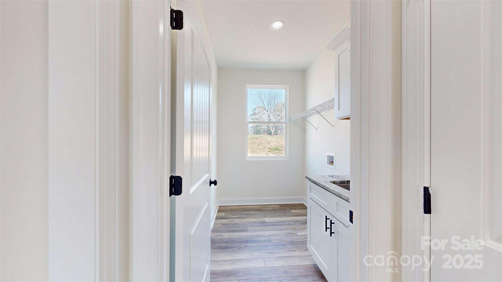 2906 Lathan Road Monroe, NC 28112 - Photo 11 of 41 a view of a bathroom with wooden floor