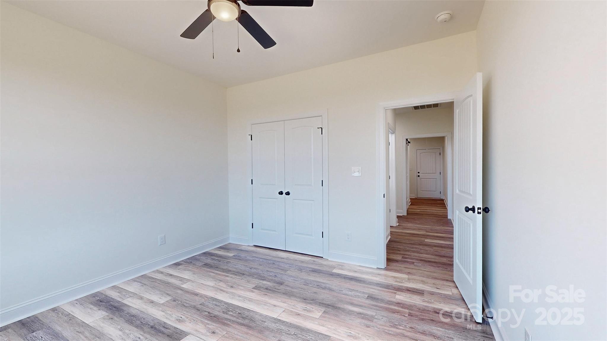 2906 Lathan Road Monroe, NC 28112 - Photo 17 of 41 a view of a hallway with wooden floor