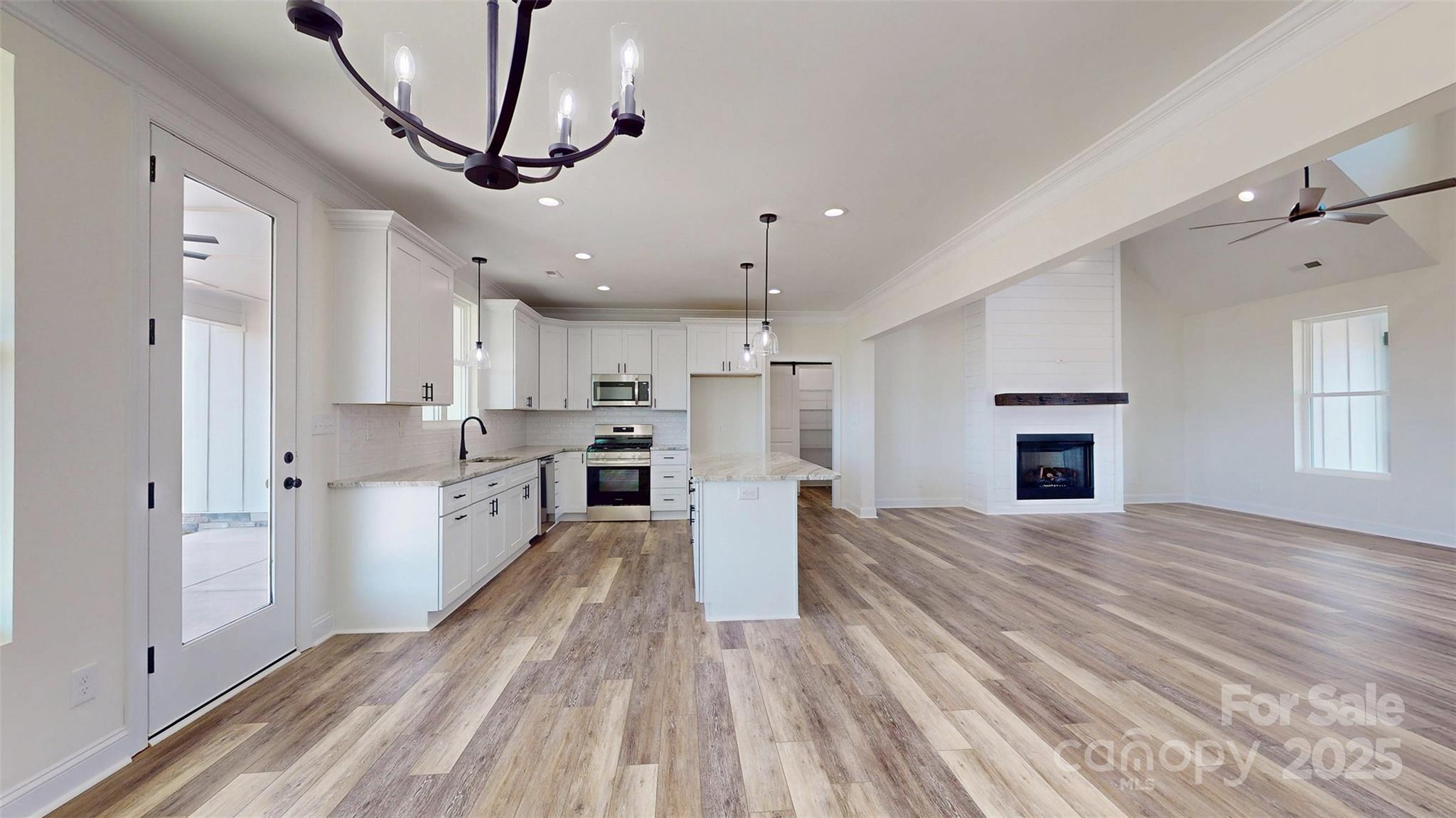 2906 Lathan Road Monroe, NC 28112 - Photo 26 of 41 a view of kitchen with sink microwave and refrigerator