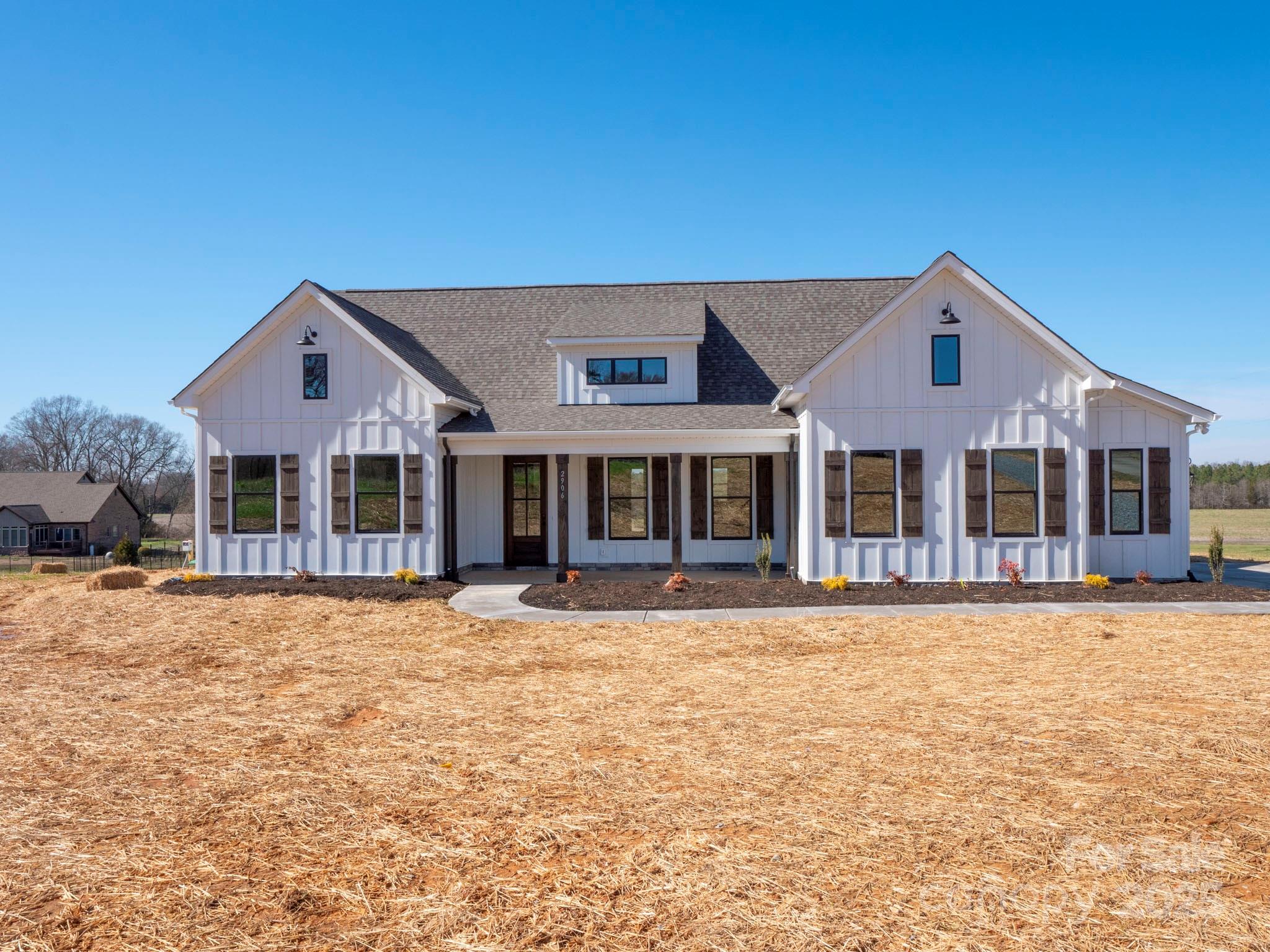 2906 Lathan Road Monroe, NC 28112 - Photo 40 of 41 a front view of a house with a yard