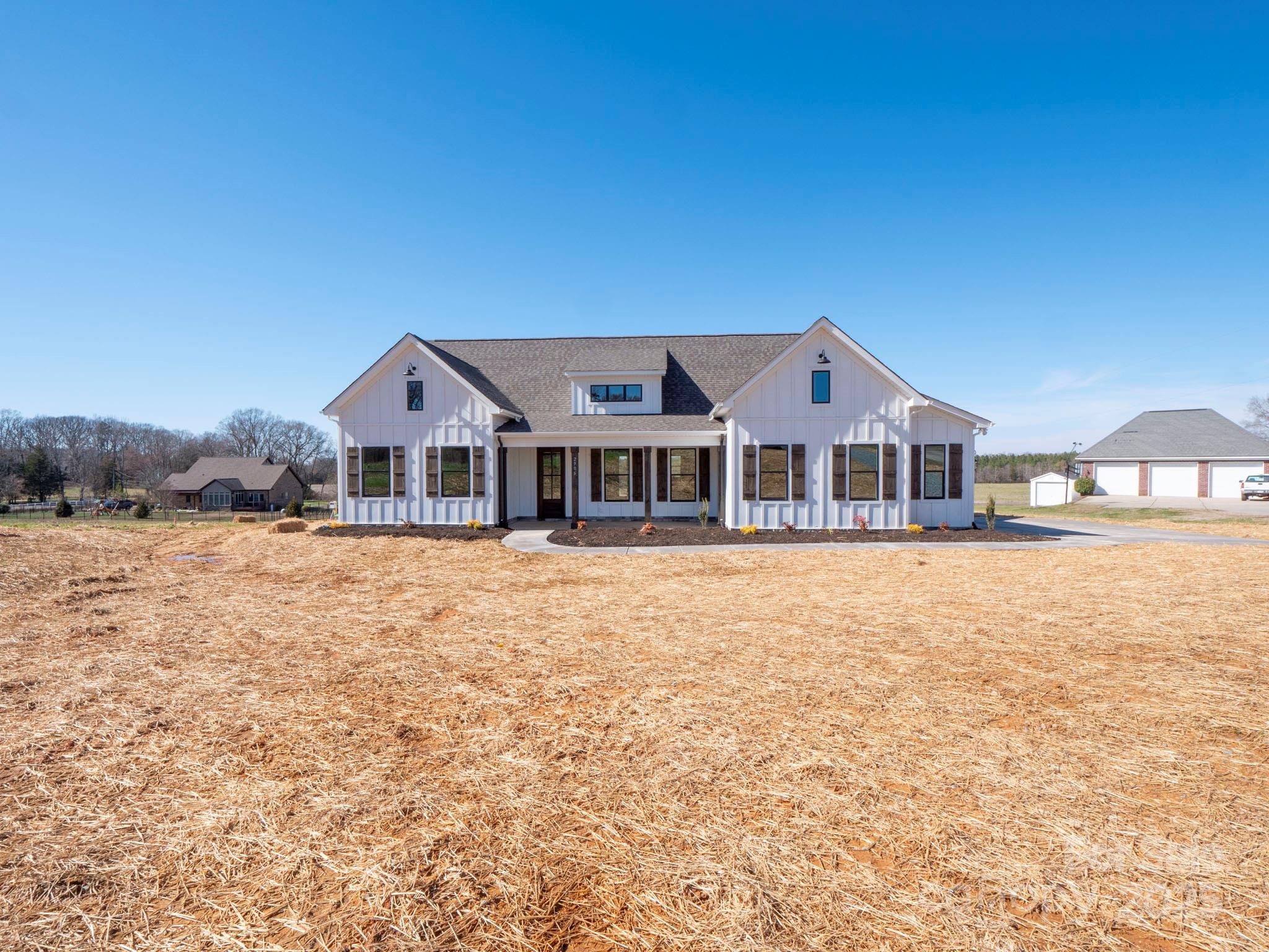 2906 Lathan Road Monroe, NC 28112 - Photo 41 of 41 a front view of a house with a yard