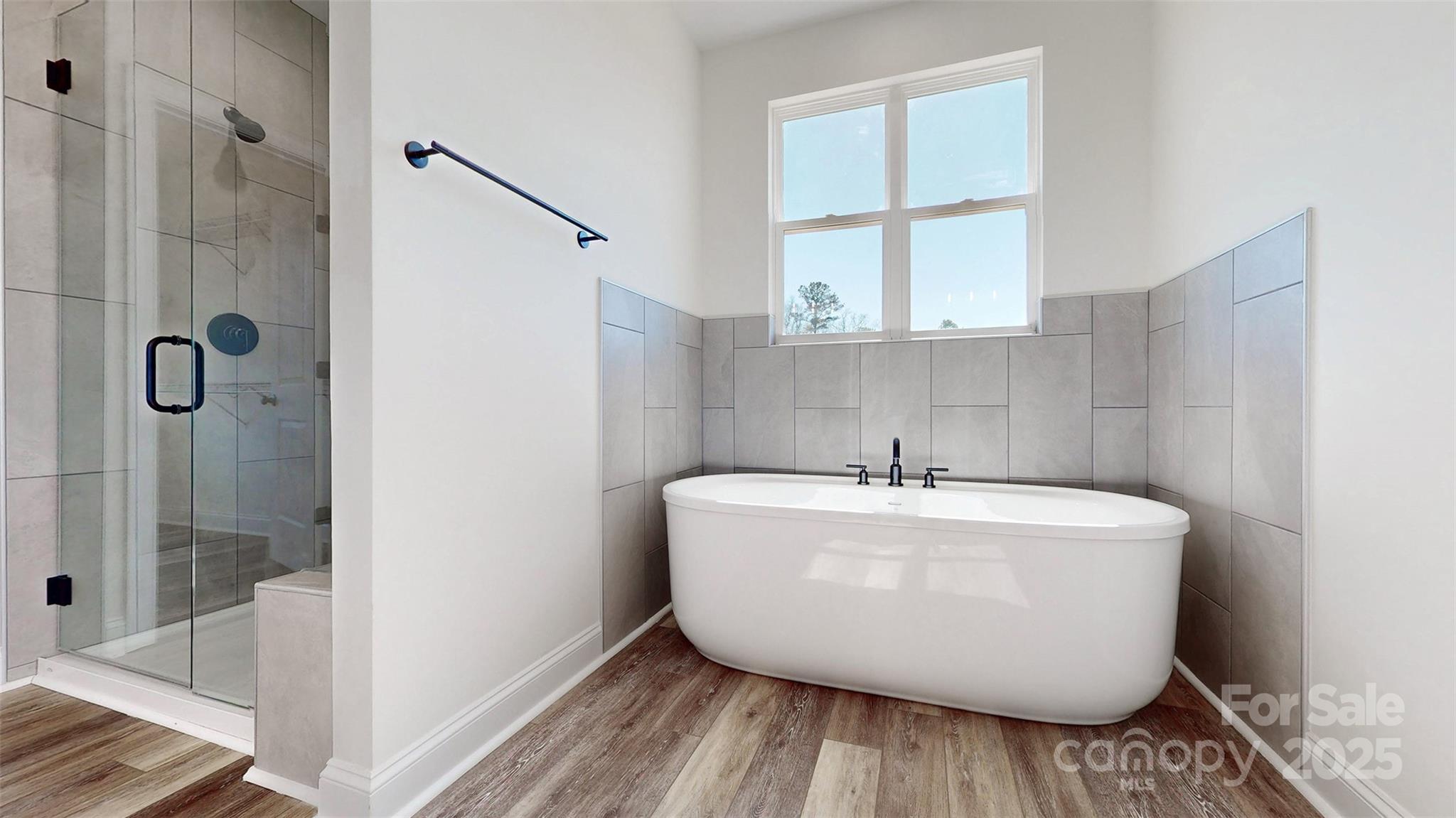 2906 Lathan Road Monroe, NC 28112 - Photo 6 of 41 a bathroom with a bathtub and shower