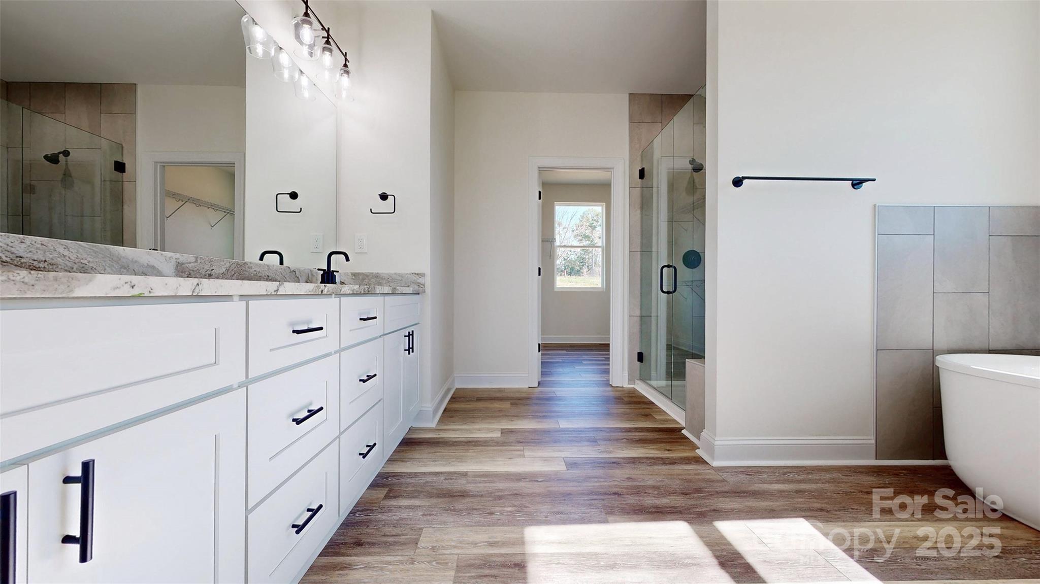 2906 Lathan Road Monroe, NC 28112 - Photo 7 of 41 a bathroom with sink and mirror