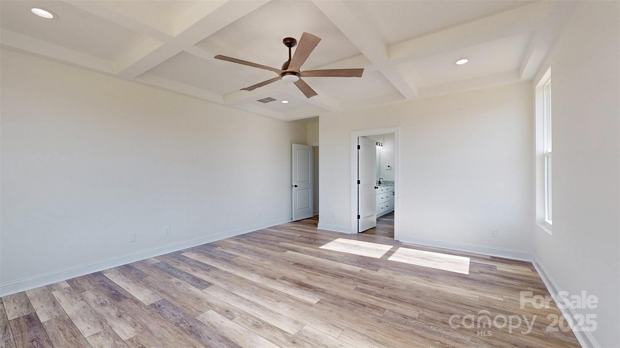 2906 Lathan Road Monroe, NC 28112 - Photo 9 of 41 a view of empty room with wooden floor and ceiling fan