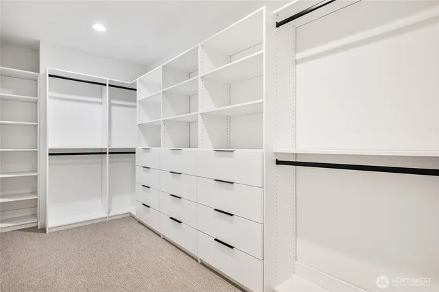 a bathroom with a double vanity sink mirror and shower