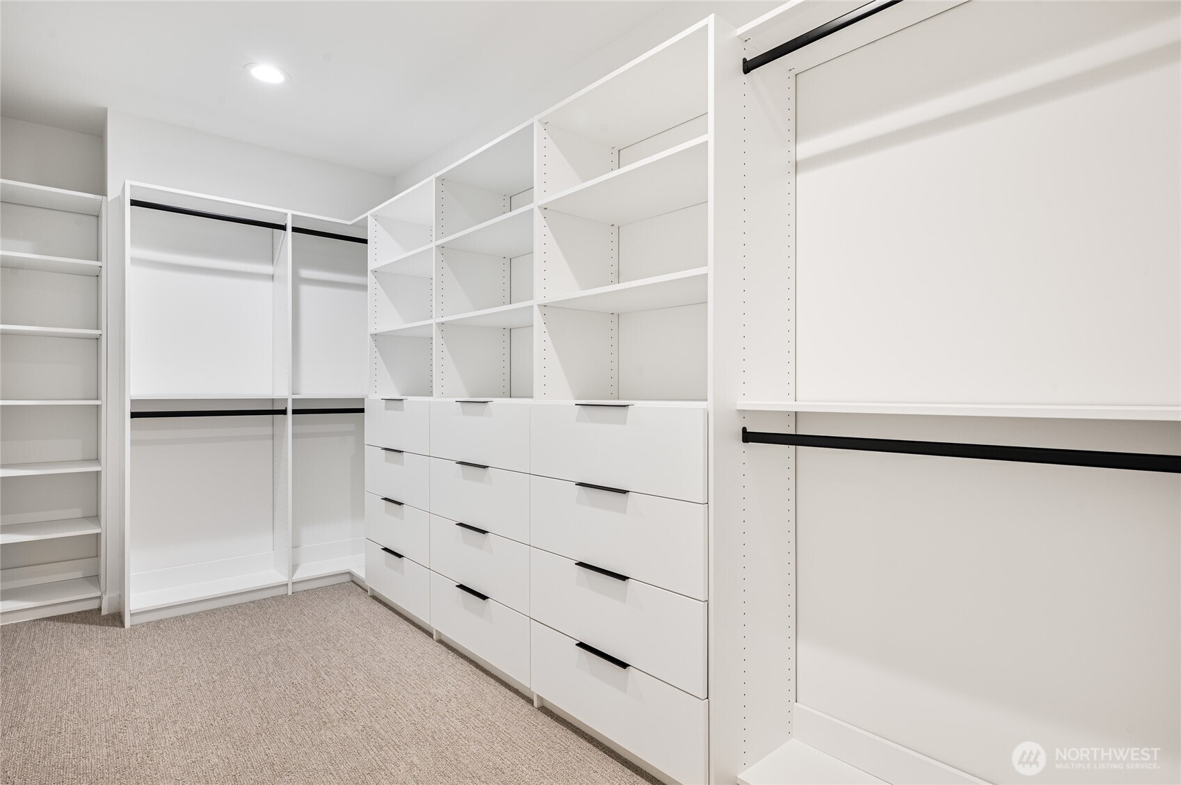 1176 129th Avenue Southeast Bellevue, WA 98005 - Photo 17 of 32 a view of walk in closet with empty racks