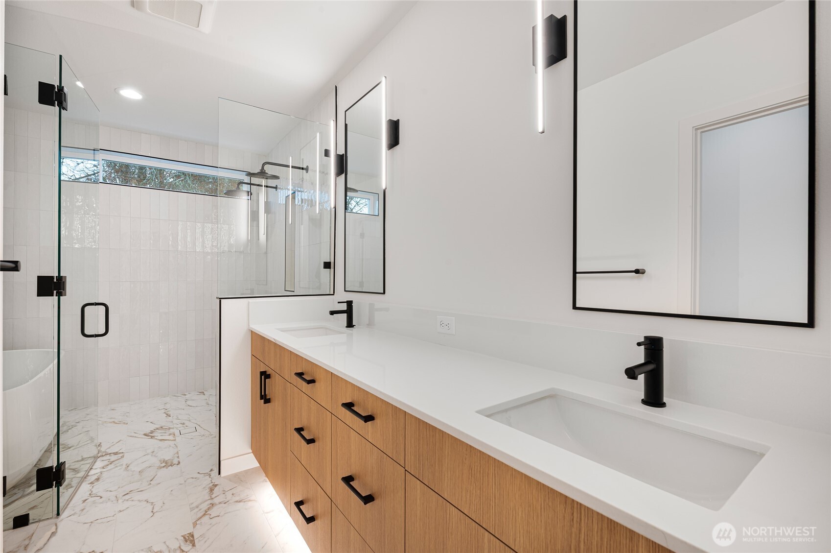 1176 129th Avenue Southeast Bellevue, WA 98005 - Photo 18 of 32 a bathroom with a double vanity sink mirror and shower
