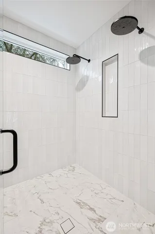 a white bath tub sitting in a bathroom