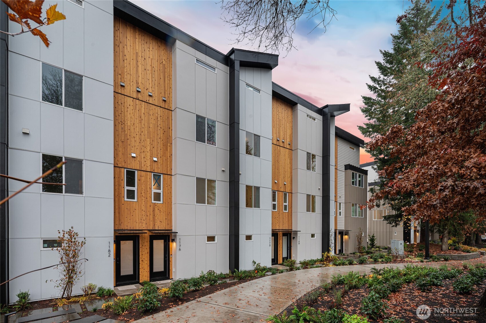 1176 129th Avenue Southeast Bellevue, WA 98005 - Photo 2 of 32 a front view of a building with a garden and plants