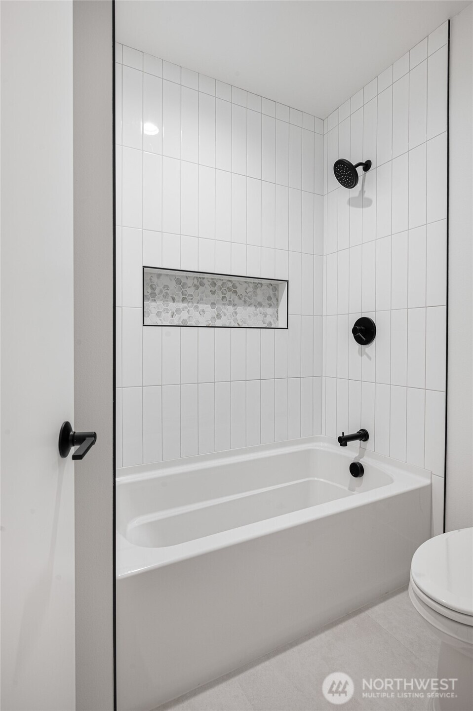 1176 129th Avenue Southeast Bellevue, WA 98005 - Photo 24 of 32 a bathroom with a shower and a bathtub