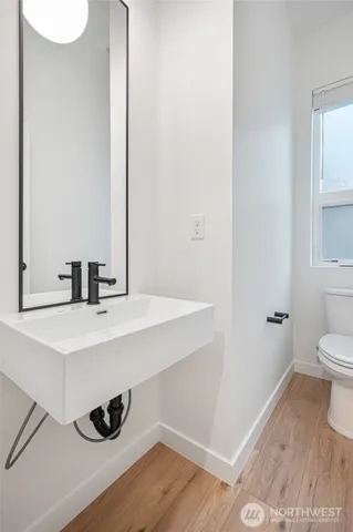 a view of a hallway with washer and dryer