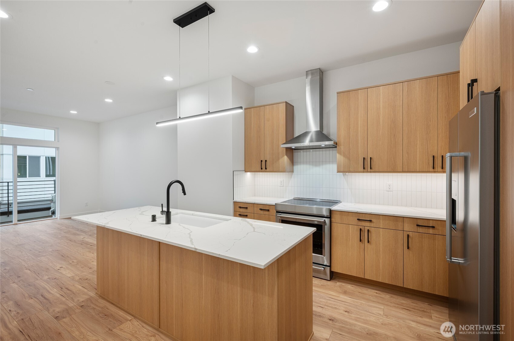 1176 129th Avenue Southeast Bellevue, WA 98005 - Photo 8 of 32 a kitchen with stainless steel appliances a sink and a refrigerator