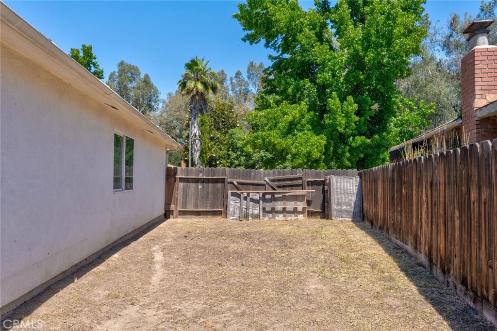 1840 Cheyenne Drive Merced, CA 95348 - Photo 78 of 90 a view of roof deck with chairs and wooden fence