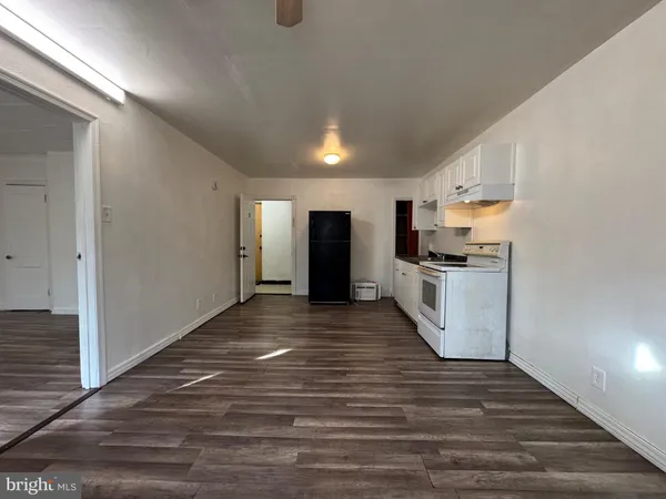 a view of kitchen and wooden floor