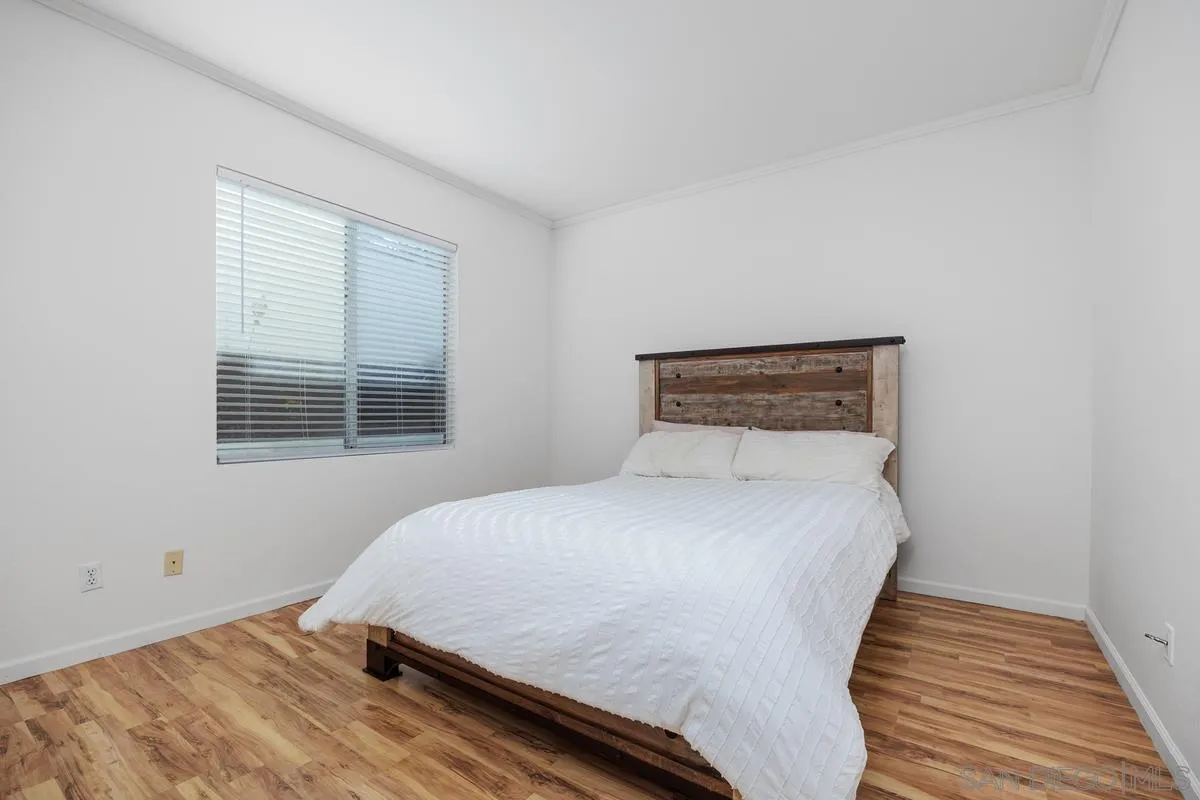 3643 Merced Drive Oceanside, CA 92056 - Photo 19 of 27 a bedroom with a bed and window