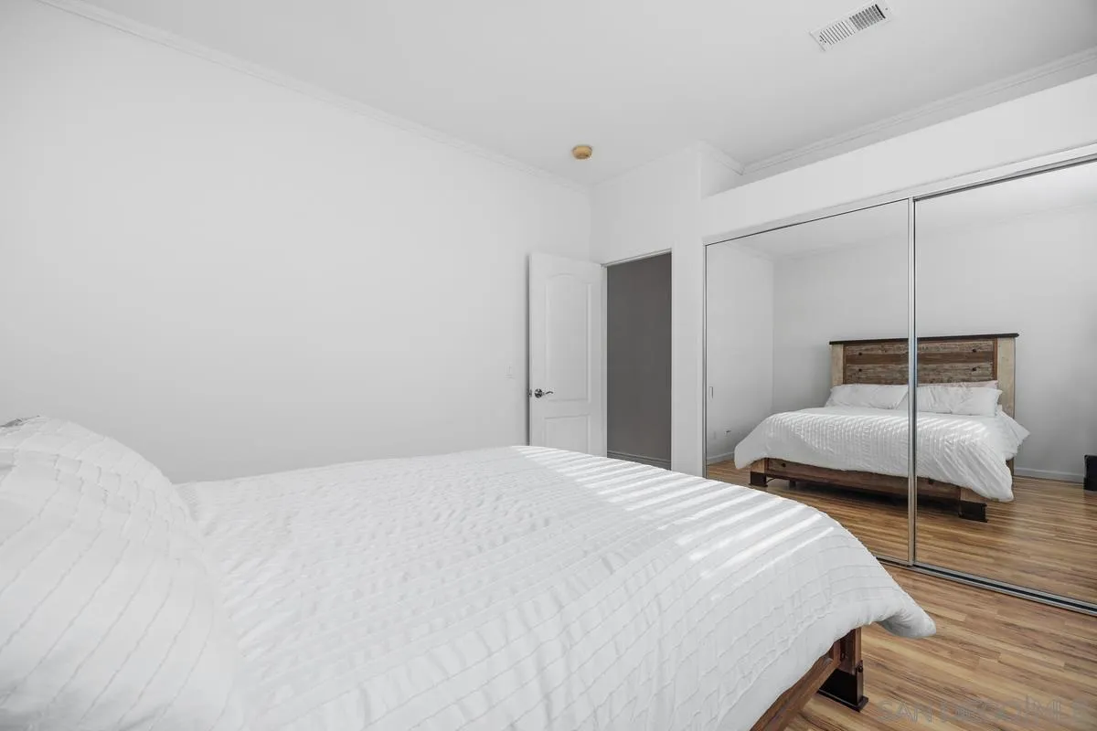 3643 Merced Drive Oceanside, CA 92056 - Photo 20 of 27 a bedroom with a bed and a large window