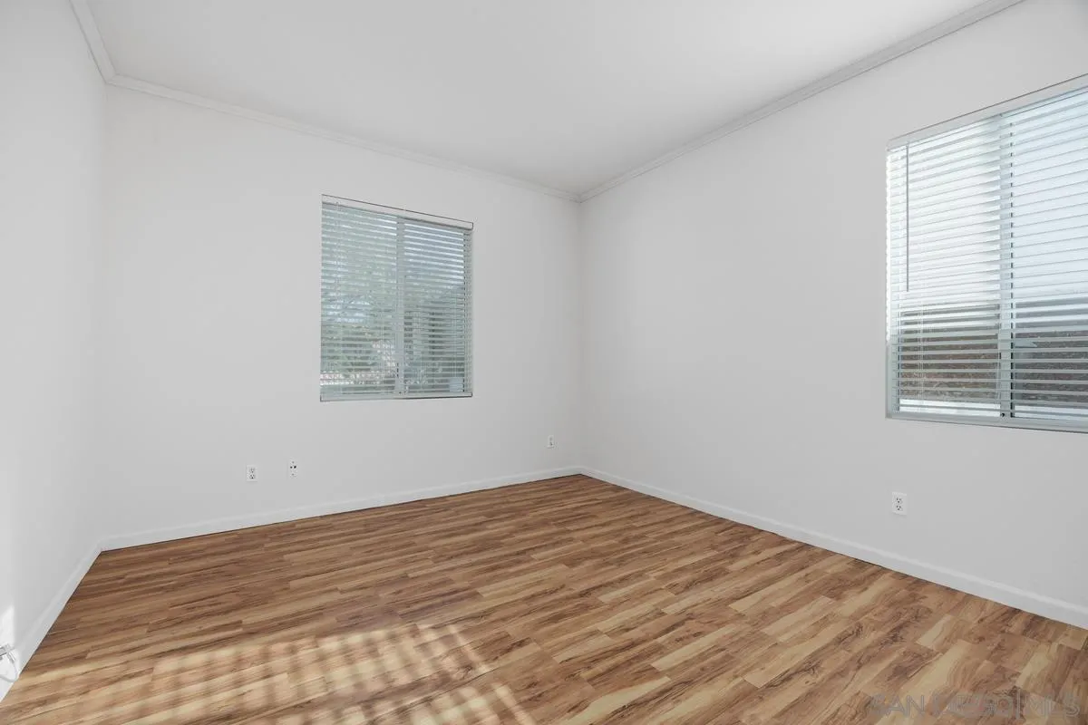 3643 Merced Drive Oceanside, CA 92056 - Photo 22 of 27 a view of empty room with wooden floor