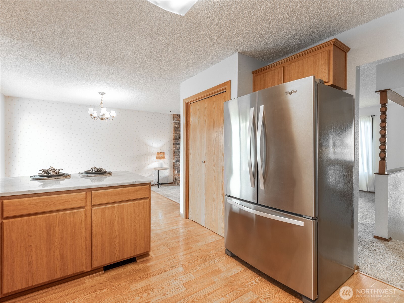 1317 Wedgewood Avenue Wenatchee, WA 98801 - Photo 15 of 39 a kitchen with stainless steel appliances a refrigerator and a sink