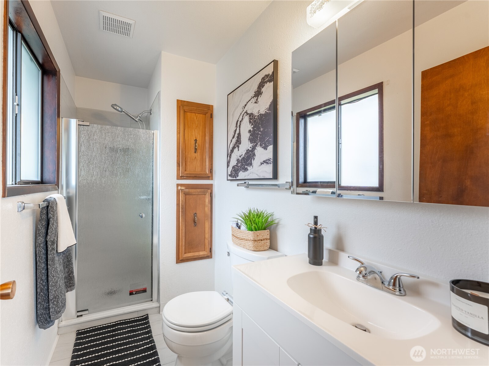 1317 Wedgewood Avenue Wenatchee, WA 98801 - Photo 23 of 39 a bathroom with a sink toilet and shower