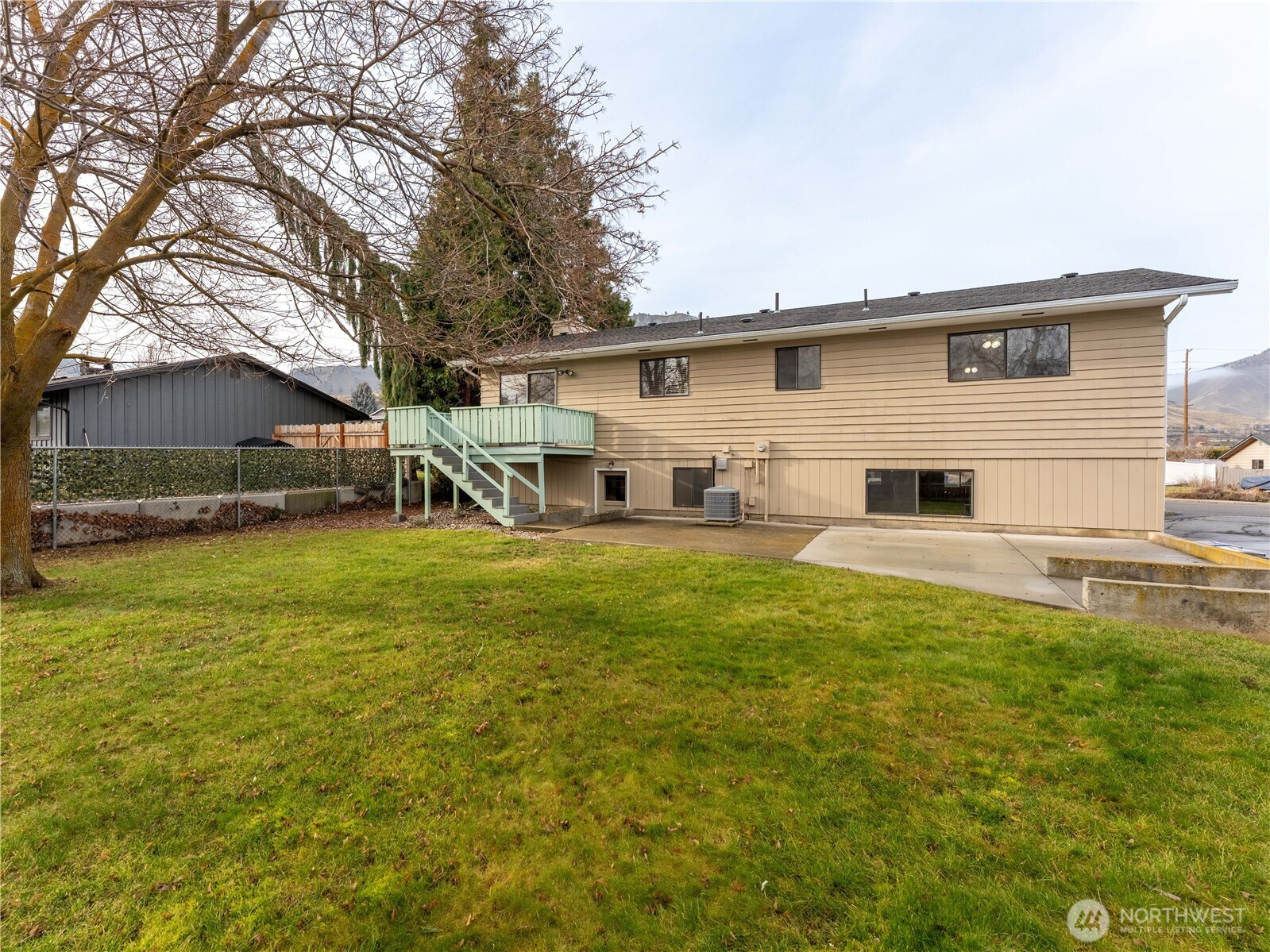 1317 Wedgewood Avenue Wenatchee, WA 98801 - Photo 36 of 39 a front view of a house with a yard