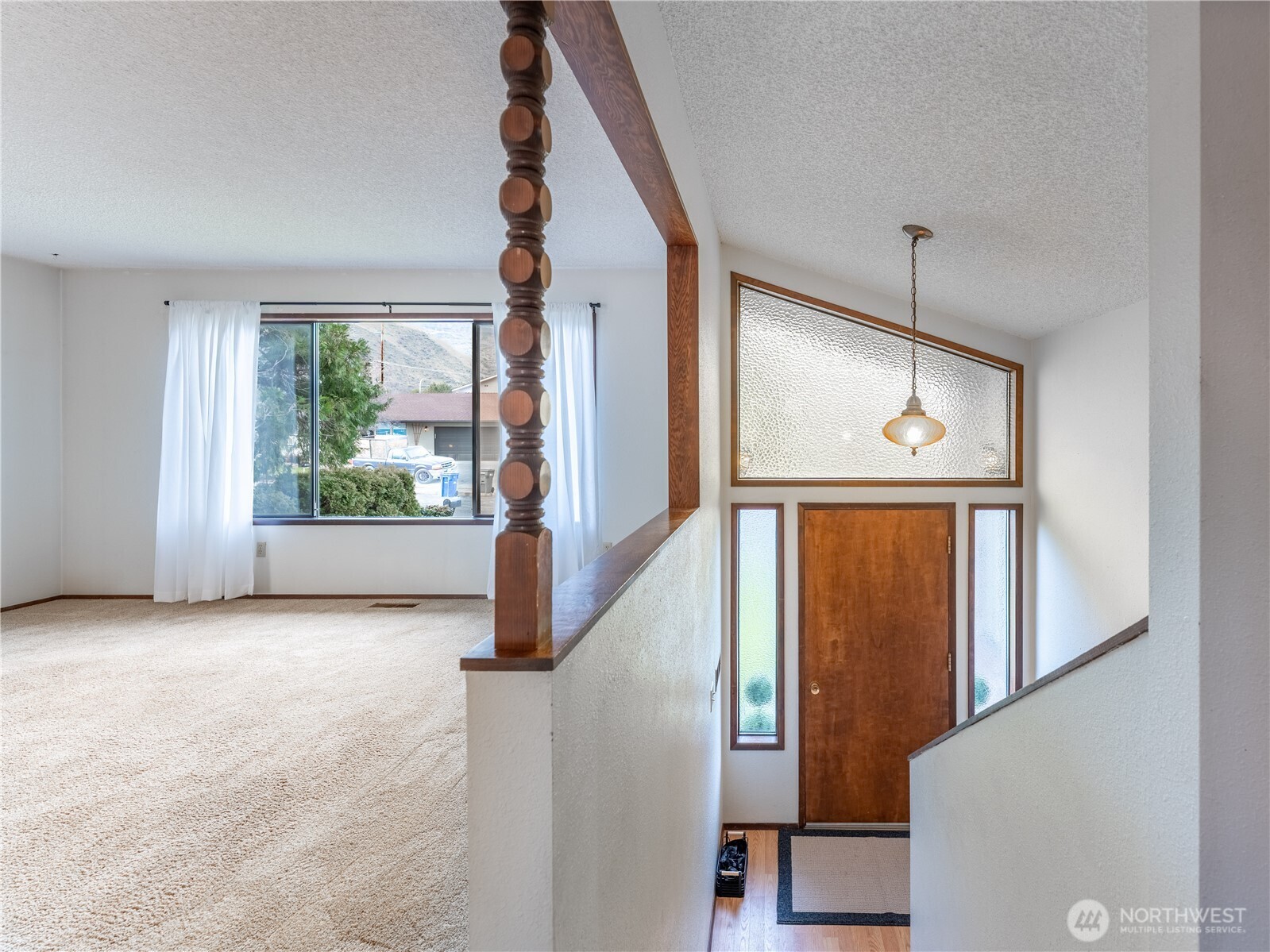 1317 Wedgewood Avenue Wenatchee, WA 98801 - Photo 7 of 39 wooden floor in an empty room with a window