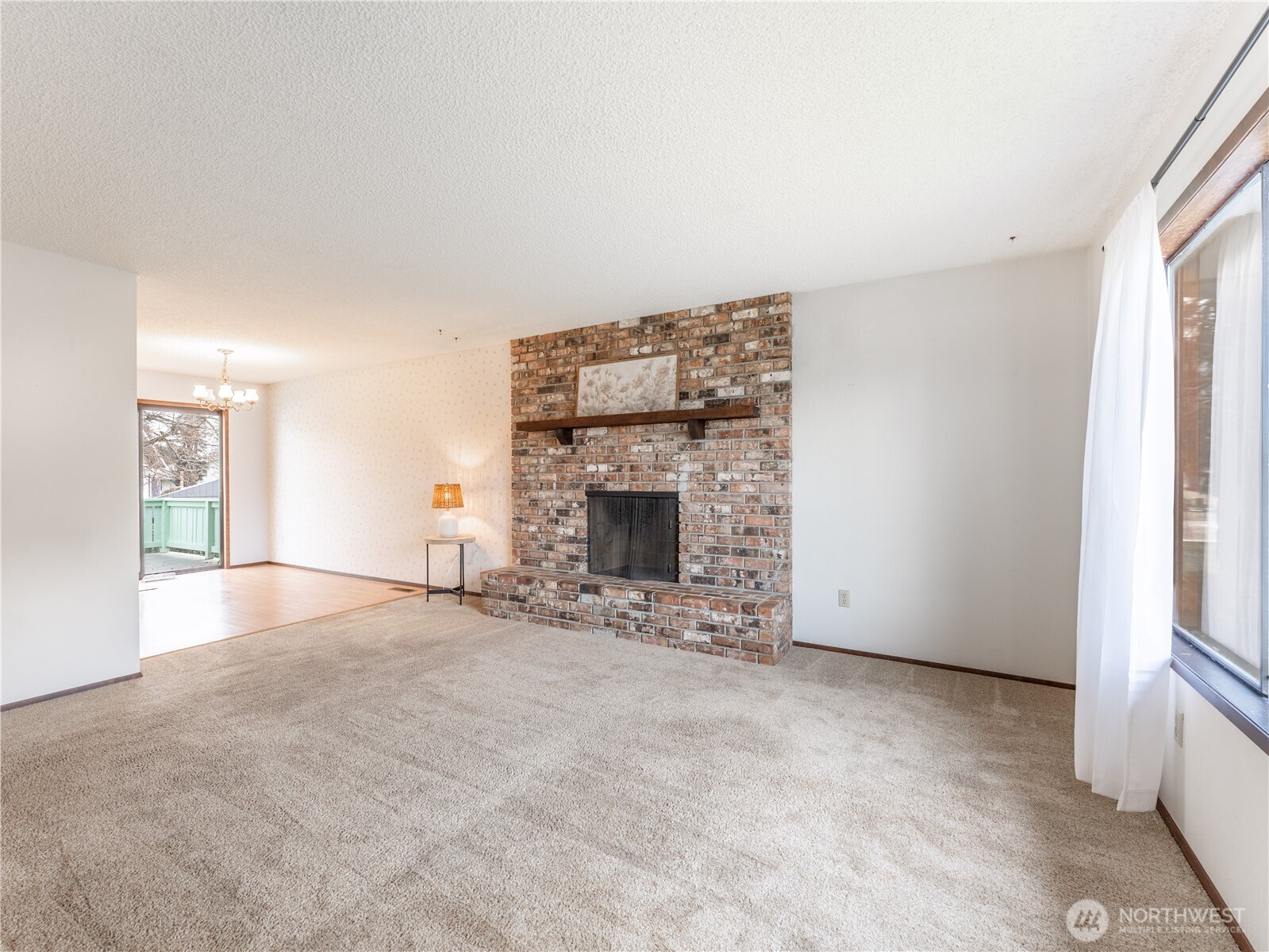 1317 Wedgewood Avenue Wenatchee, WA 98801 - Photo 8 of 39 an empty room with windows and fireplace