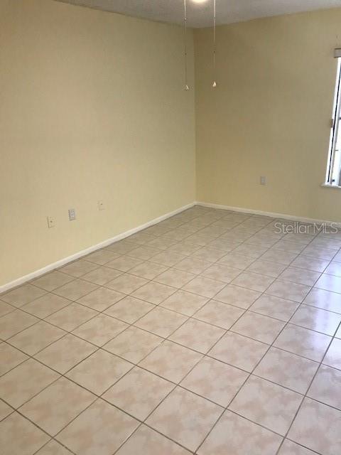715 Caribou Drive Kissimmee, FL 34759 - Photo 11 of 13 a view of a room and has window
